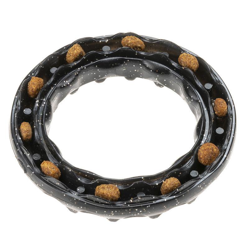 Black dog chewing ring