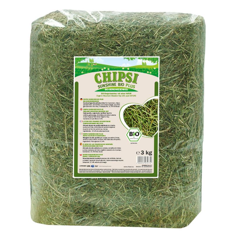 Bag of green hay with a visible label on a white background