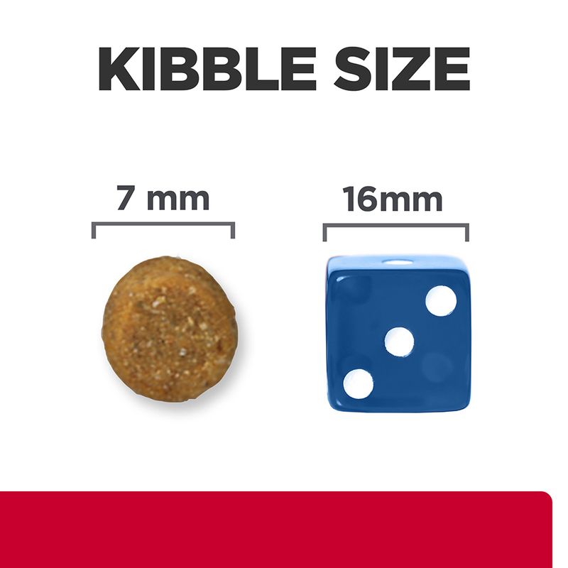 Comparison of kibble size with a 7 mm diameter round kibble and a 16 mm blue die on a white background.
