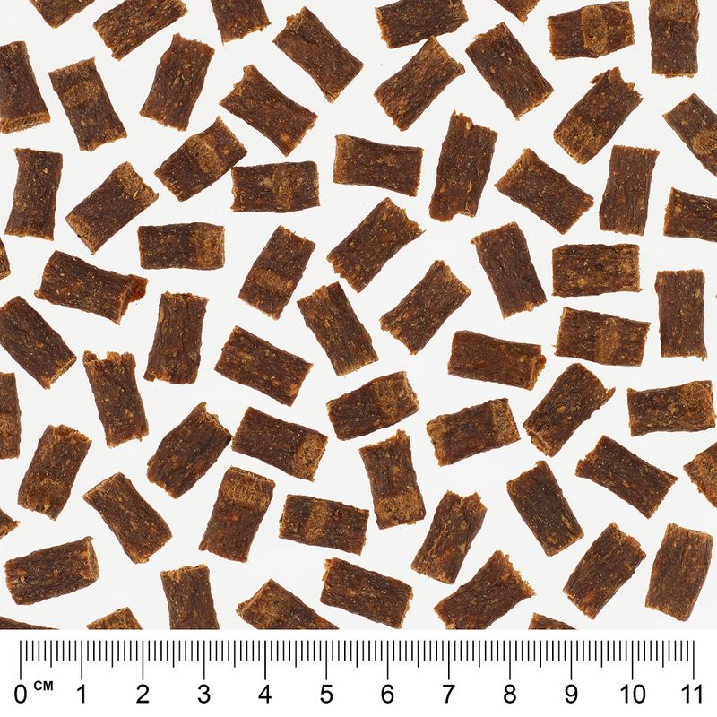 Pattern of small brown rectangular pieces with a ruler at the bottom for scale.