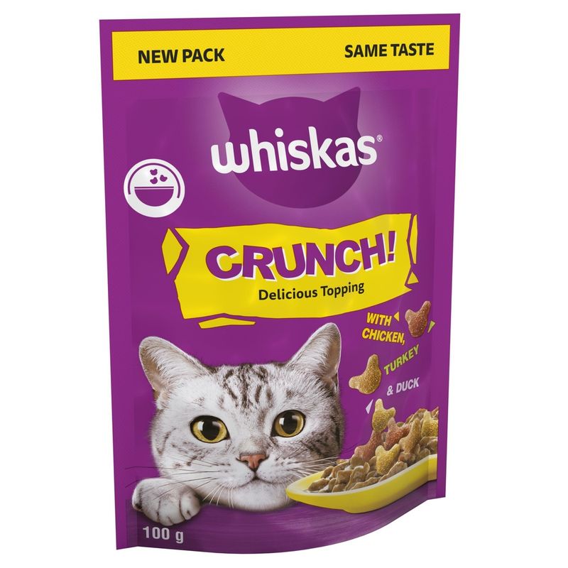 Whiskas Crunch cat food packaging with a purple background and yellow accents.