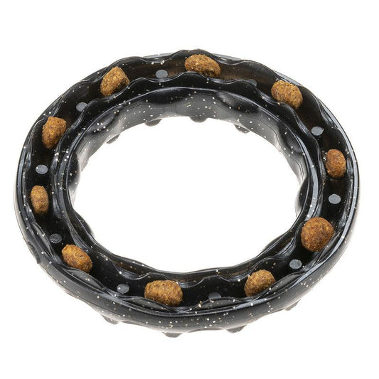 Black dog chewing ring