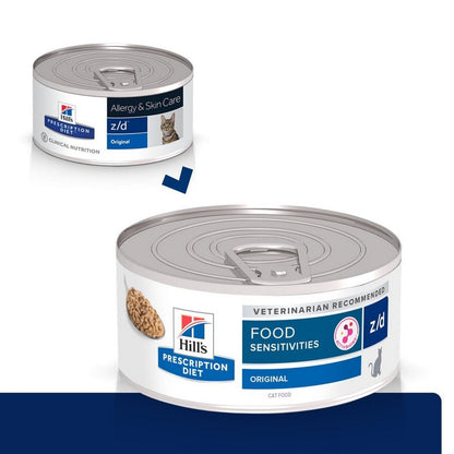 Two cans of Hills Prescription Diet z/d food for cats on a white background