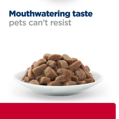 Cat with Hill’s c/d food pouch
