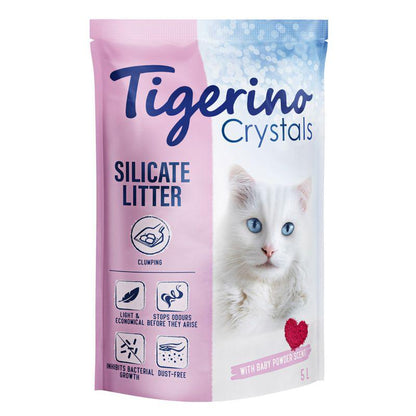 Package of Tigerino Crystals Clumping Cat Litter with a baby powder scent. The packaging is pink and white with an image of a white cat on the front and product details.