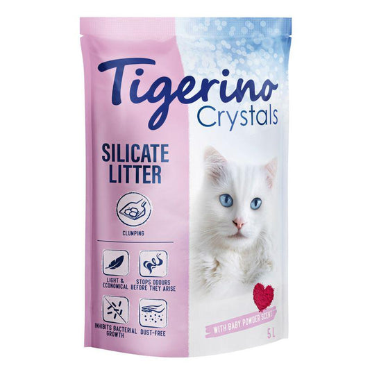 Package of Tigerino Crystals Clumping Cat Litter with a baby powder scent. The packaging is pink and white with an image of a white cat on the front and product details.