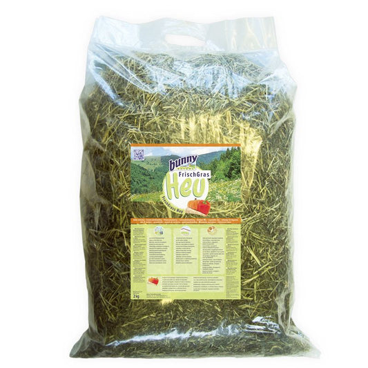 Bag of hay with a label on a white background