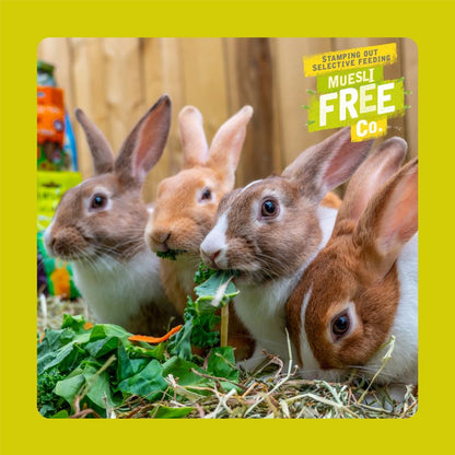 Three rabbits eating greens with a Muesli Free Co. product in the background